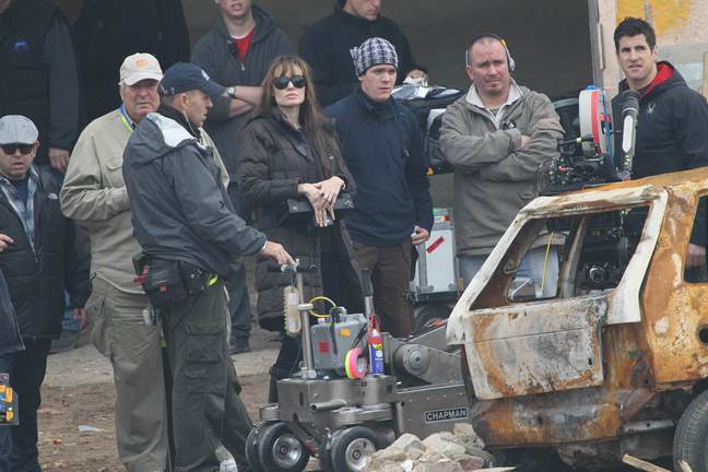 Angelina Jolie, movie set, black jacket, black boots